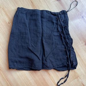 Black skirt with side tie up details